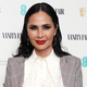 Actress Talisa Garcia wears a white shirt and grey jacket on the red carpet.